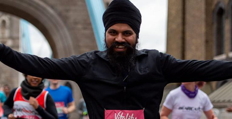 A runner smiling on Tower Bridge