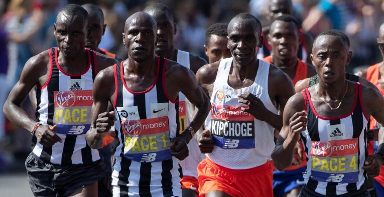 Eliud Kipchoge runs with pacemakers at the London Marathon