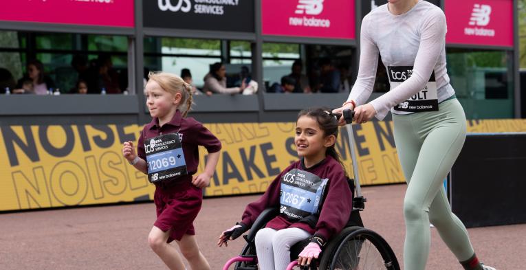 two children and adult participating in the mass mini london marathon