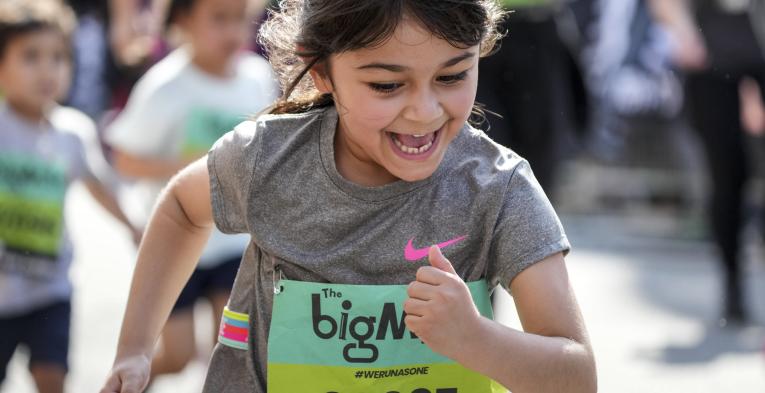 Child running in The Big Mile