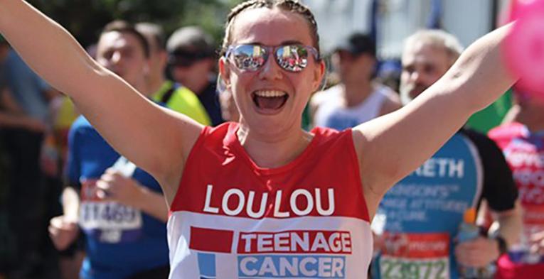 A lady running wearing sun glasses