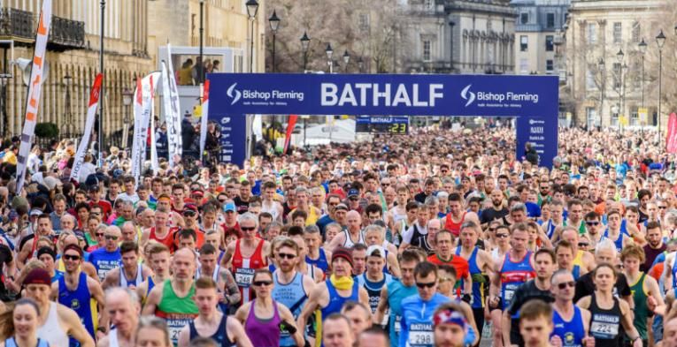 A very large amount of people running in Bath dressed colourfully