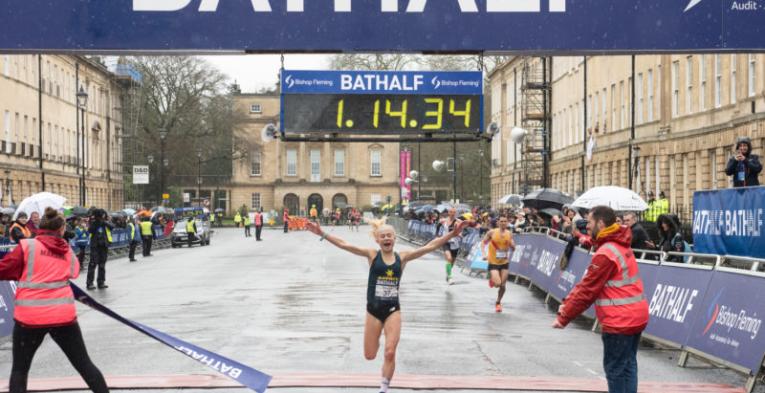 Lady wining the Bath Half