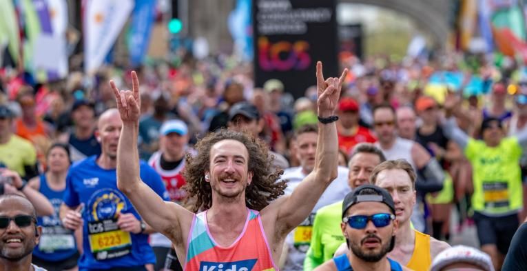 Man in crowd running marathon