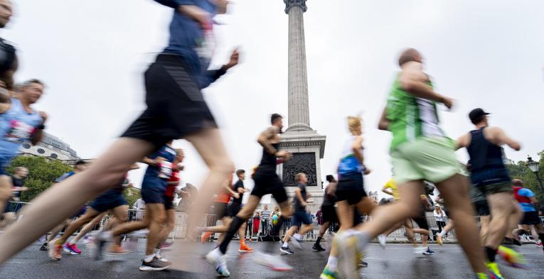 Vitality London 10,000 runners pass by Nelson's Column