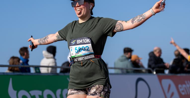 Brighton & Hove 10K smiles as he is snapped by a photographer