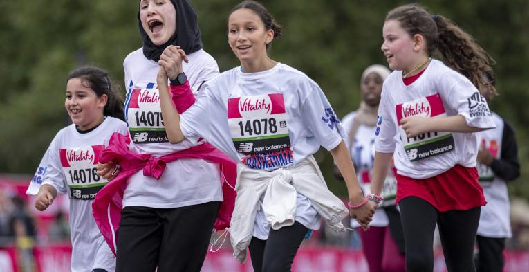 Participants celebrate their achievement at the Vitality Westminster Mile