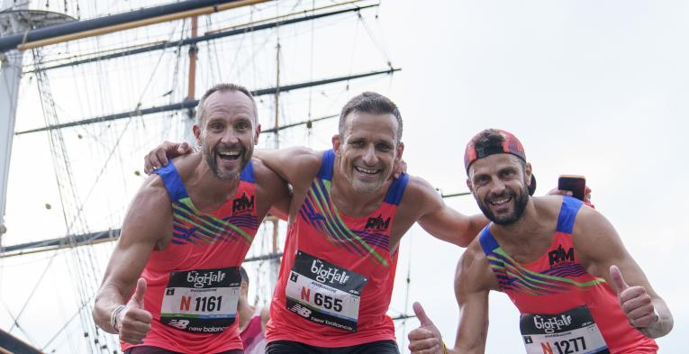 The Big Half finishers pose by the Cutty Sark