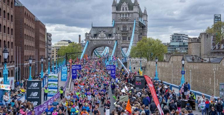 Runners cross Tower Bridge at the TCS London Marathon