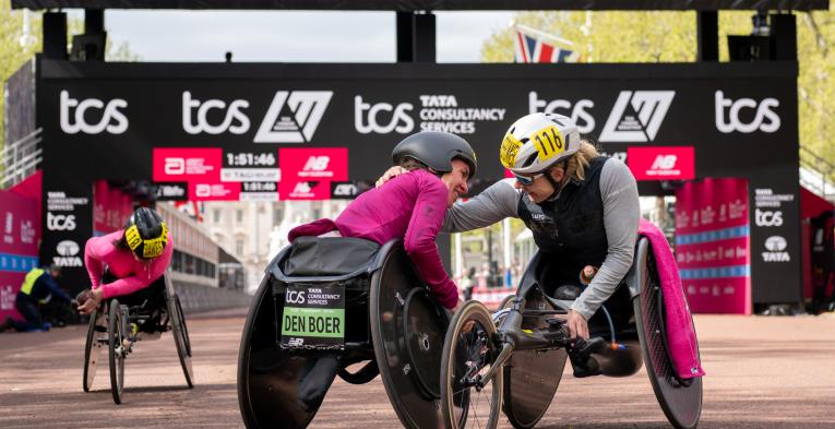 Nikita den Boer embraces Catherine Debrunner at the Finish Line on The Mall after completing the Elite Women’s Wheelchair Race