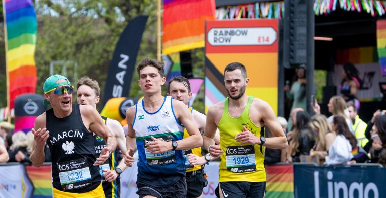 Runners pass through Rainbow Row 