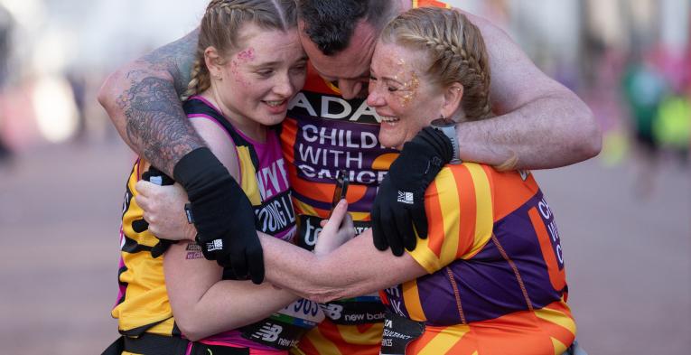 TCS London Marathon participants hugging at the Finish Line