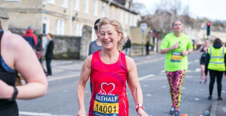 A lady running with a big smile.