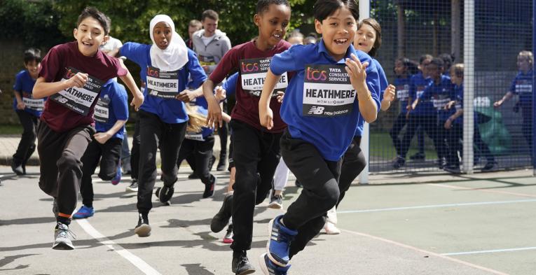 School children complete their mile in the playground