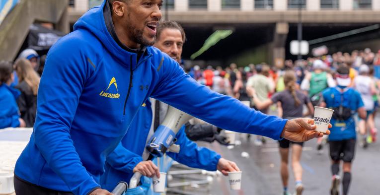 Anthony Joshua handing out Lucozade Sport at the TCS London Marathon