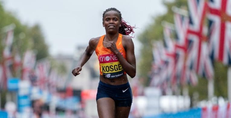 Brigid Kosgei (KEN) runs along The mall during the Elite Women's Race