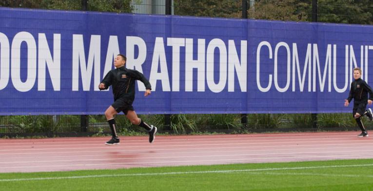 Two runners on the London Marathon Community Track, funded by The London Marathon Charitable Trust