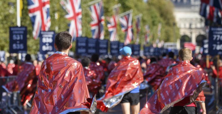 Finishers of the London Marathon wear foil blankets