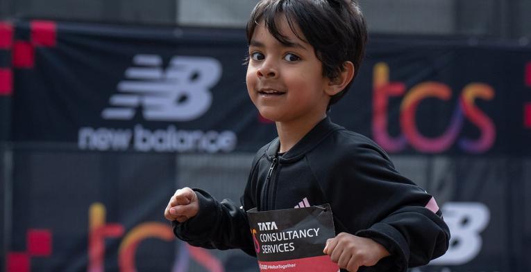 A young participant heads towards the finish line on The Mall