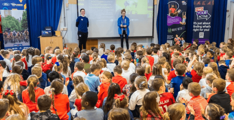 Katie Archibald giving an assembly to a school