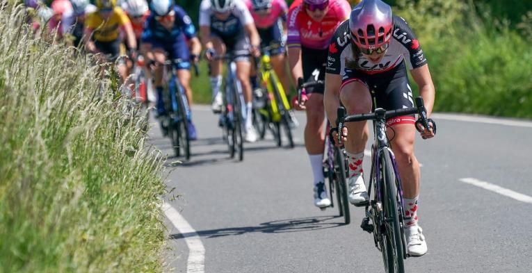 Elite cyclists riding on a country road