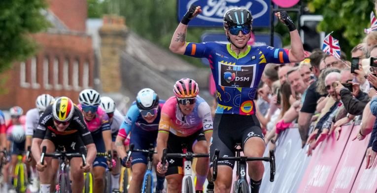 Lorena Wiebes (NED) of Team DSM (NED) salutes her victory after sprinting to win the stage on High Street Epping. 