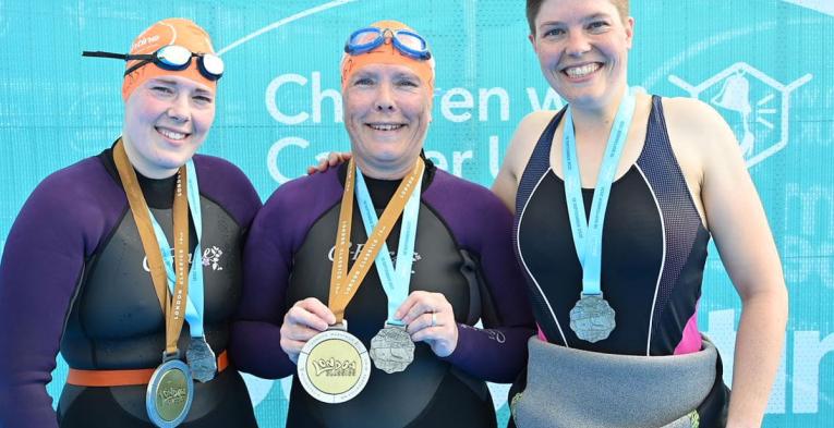 Swimmers wear Swim Serpentine medals