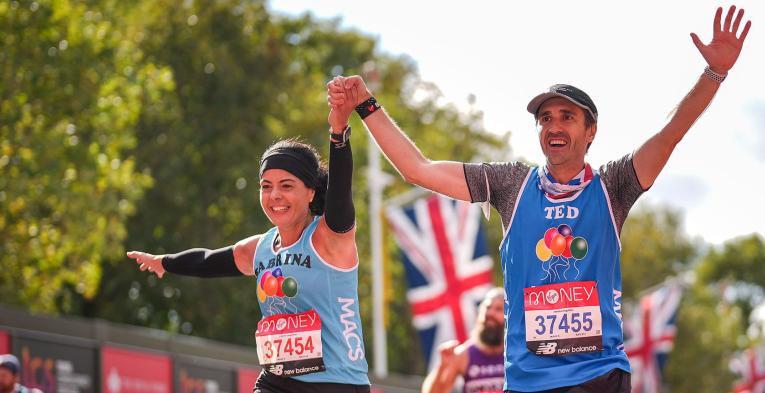 Runners on The Mall celebrate as they approach the Finish Line