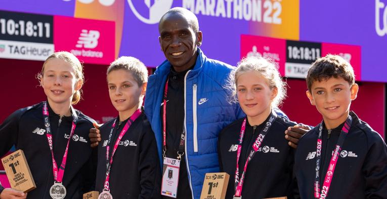 Eliud Kipchoge with winners at the 2022 TCS Mini London Marathon