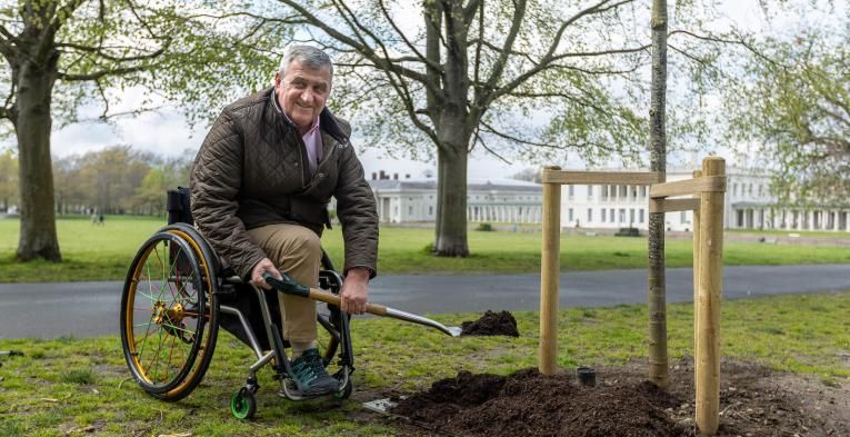 Gordon Perry plants a tree