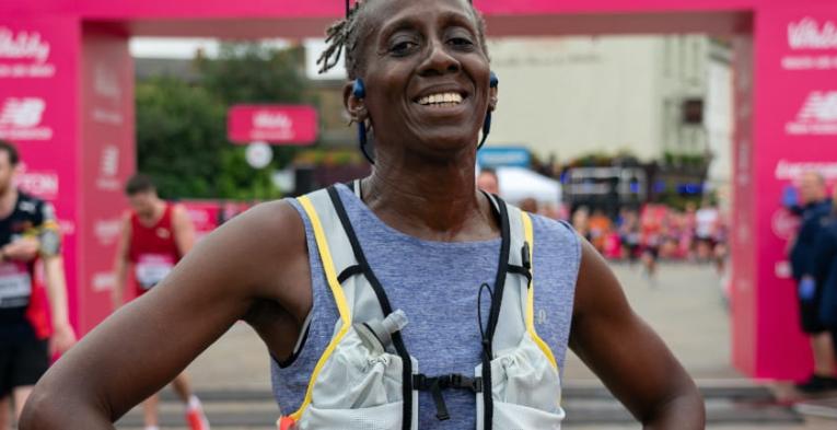 A 2021 Vitality Big Half runner is all smiles after completing the race