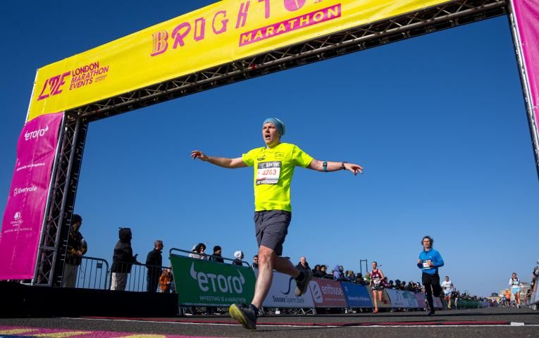 Runner crossing the Finish Line