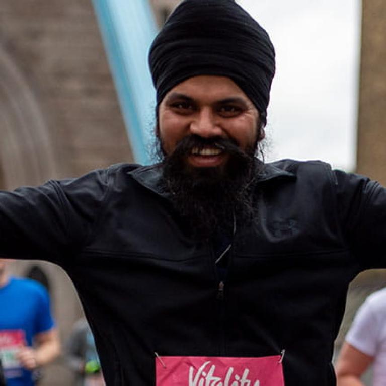 A runner smiling on Tower Bridge