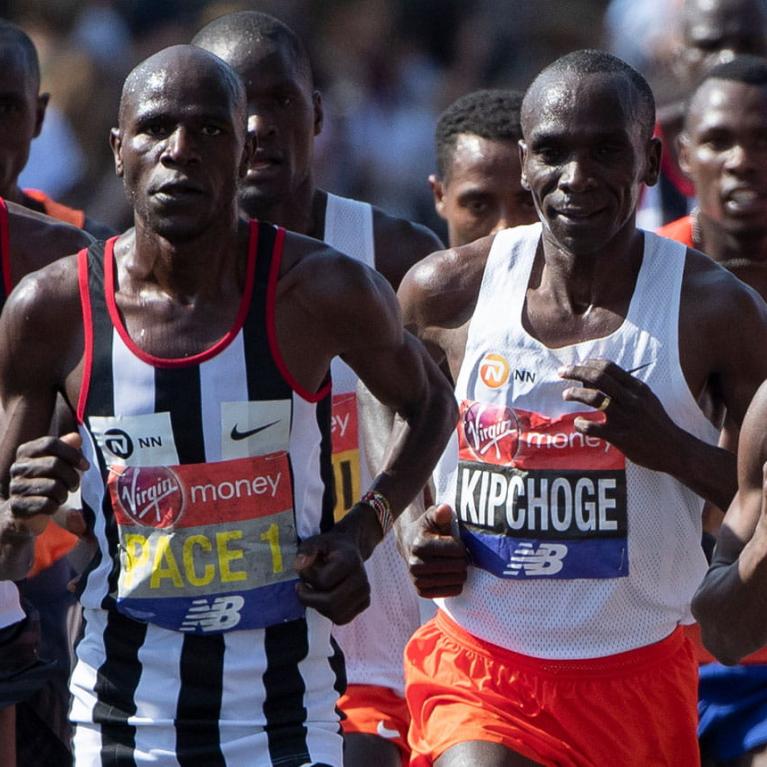 Eliud Kipchoge runs with pacemakers at the London Marathon