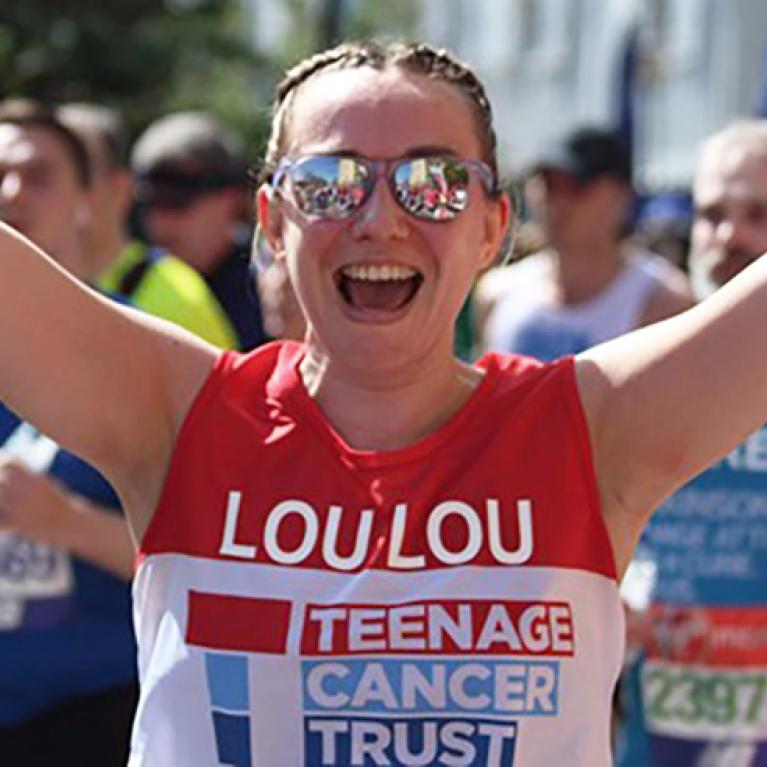 A lady running wearing sun glasses