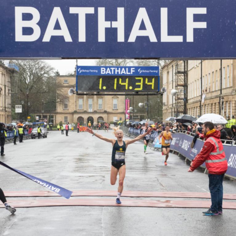 Lady wining the Bath Half