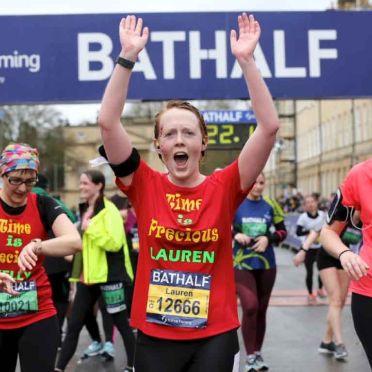 People finishing a half marathon