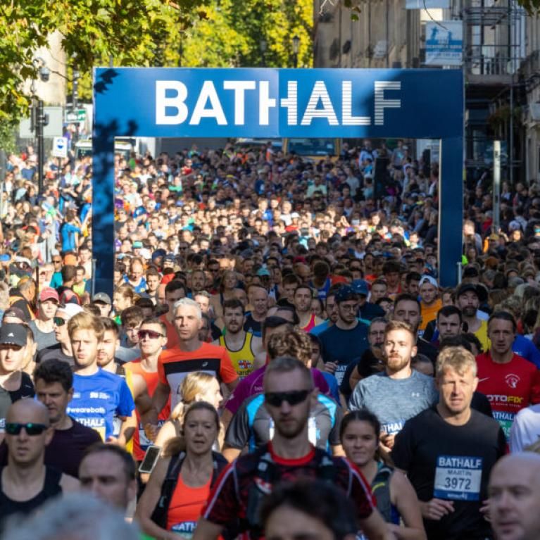 Runners flooding the streets of bath.