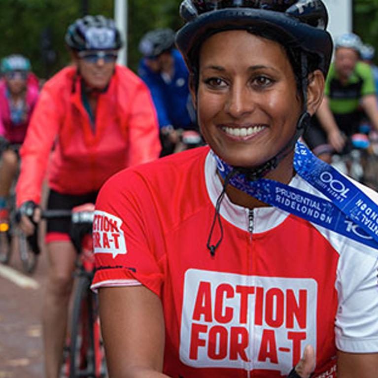 A cyclist smiling.