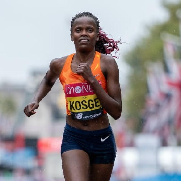 Brigid Kosgei (KEN) runs along The mall during the Elite Women's Race