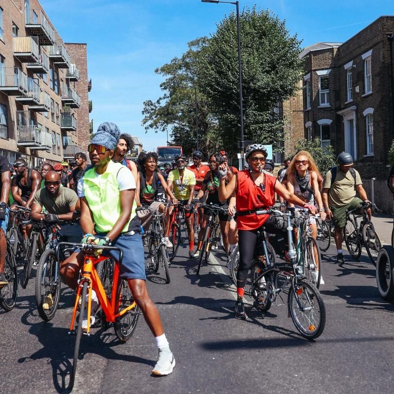 A group of cyclists assembled on bikes