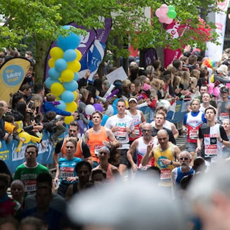 Runners passing through Canary Wharf