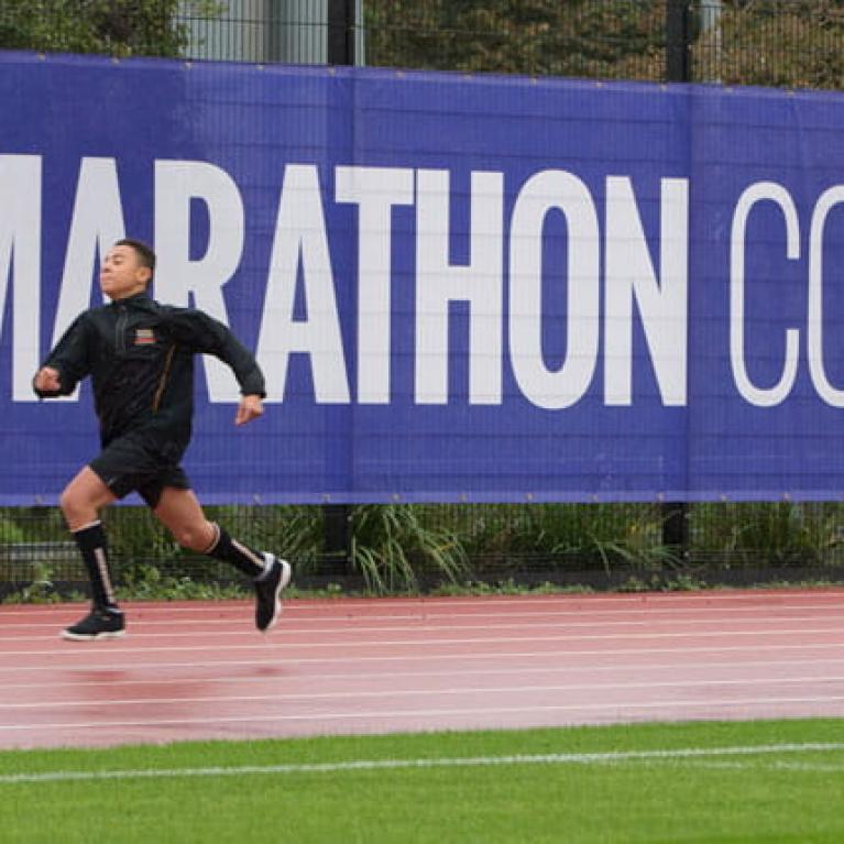 Two runners on the London Marathon Community Track, funded by The London Marathon Charitable Trust