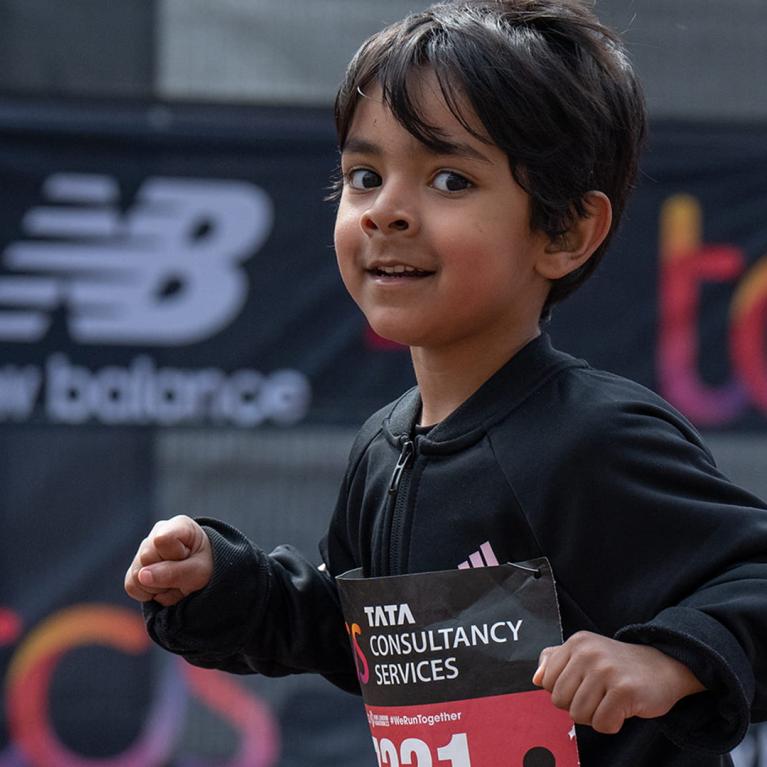 A young participant heads towards the finish line on The Mall