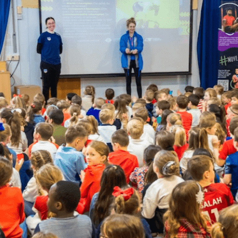 Katie Archibald giving an assembly to a school