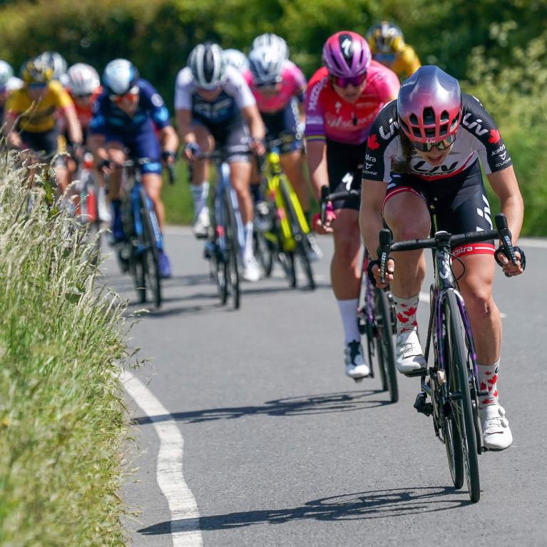 Elite cyclists riding on a country road