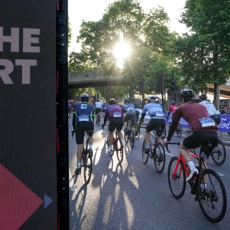 Signage and cyclists at the Ford RideLondon Classique