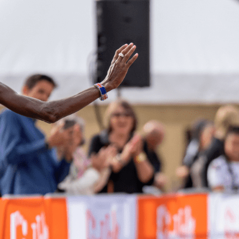 photo of sir mo waving at the crowd at the 2022 The Big Half