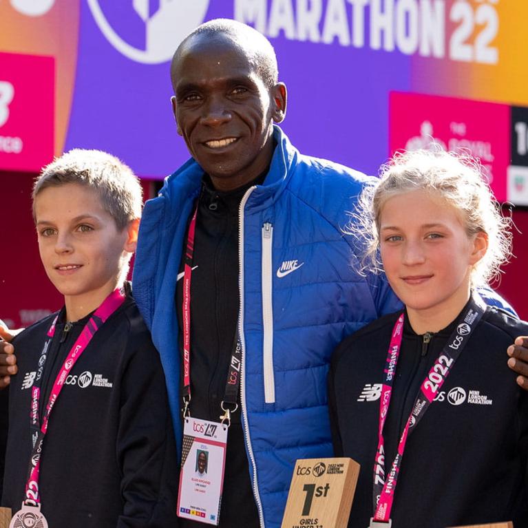 Eliud Kipchoge with winners at the 2022 TCS Mini London Marathon