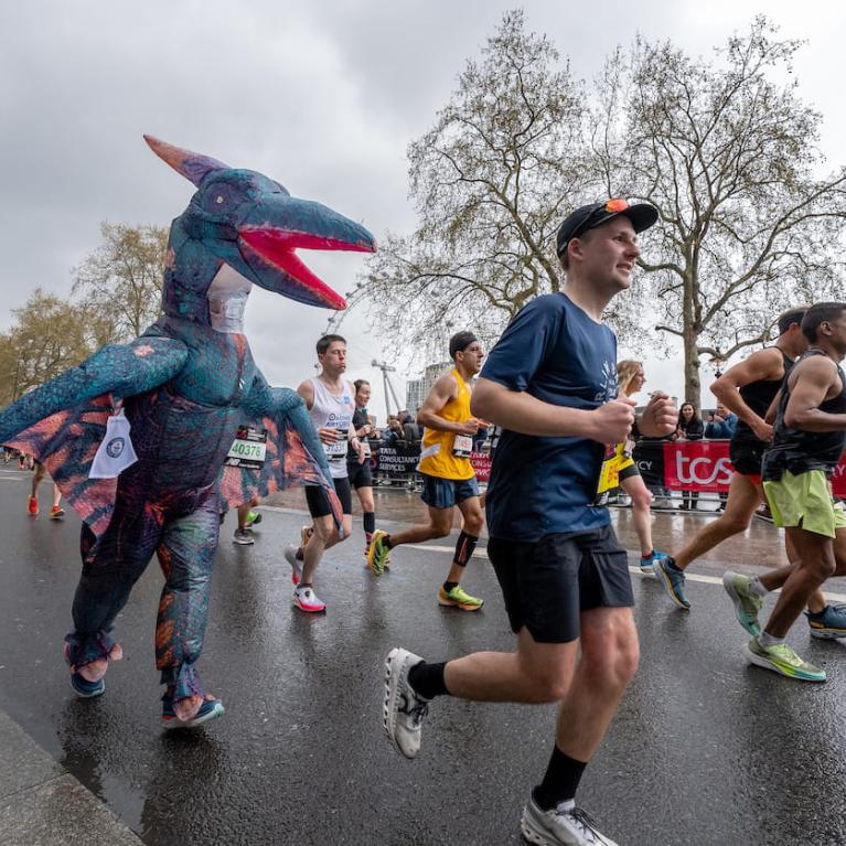 A TCS London Marathon participant dressed as a dinosaur